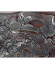 Close-up of a hand-carved lacquered rosewood 19th-c. Chinese wall plaque with bird, branch, leaves, and flower.