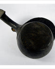 Brown hand-carved wooden mortar lying on its side against a plain white background.