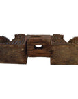 Brown teak wood architectural element with geometric patterns and circular ends on a white background.