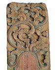 Brown wood hand carved wall plaques with ornate floral and leaf motifs, decorative style, close-up view.