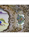 White porcelain tray with gold filigree, painted figure, and floral motifs, European style, shown on plain background.