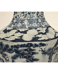 Blue and white porcelain vase with hand painted tree, cloud, and butterfly designs on a square base.