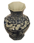 Blue and white porcelain vase with floral and cloud patterns, hexagonal shape, top view.