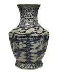 Blue and white porcelain vase with hand-painted birds, trees, and clouds patterns.