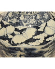 Blue and white porcelain vase with painted floral, leaf, cloud, and lotus patterns.