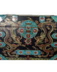 Black hand painted wooden dowry box with colorful dragon and floral designs, close-up of blue-gold detailing.