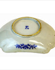 Close-up of blue floral hand painted Imari Meiji porcelain bowl with gold rim, 6 inch diameter, decorative style.