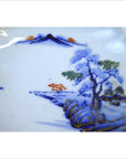 Close-up of blue, orange, and green hand painted Imari Meiji porcelain bowl with gold accents.