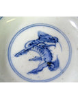White porcelain Imari small plates with hand-painted stylized bird design, set of 6, close-up view.