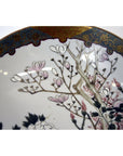 Close-up of hand painted Kutani porcelain bowl with pink blossoms and gold maroon border, 7-inch diameter.