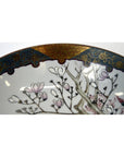 Blue and gold rimmed Kutani porcelain bowl with pink magnolia flowers, 7 inch diameter, close-up.