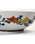 Red, yellow, and green porcelain bowl with floral and geometric patterns, 7 inch diameter.