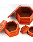 Hand-painted vintage octagonal boxes with lids, nested together, set on a white background.
