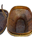 Brown rattan basket with handle and matching geometric-patterned lid shown together, both in very good condition.