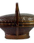 Natural rattan basket with lid, handle, and intricate woven patterns, shown in very good condition.