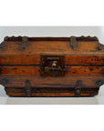 Close-up of a vintage brown lacquer wood Chinese box with iron hardware and central front latch.