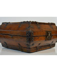 Brown lacquered Chinese box with iron hardware on white surface.