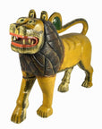 Brown hand-carved wooden lion with stylized mane and open mouth showing teeth, close-up.