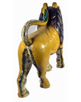 Yellow wood carved lion with dark mane and curly tail, rear view, 18 inch, good condition.