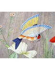 Colorful silk tapestry with blue and yellow bird flying among flowers and green leaves, 46 x 35 inches, used.