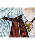Person in a patterned dress with red sash holding an India silk tapestry, all items in very good condition.
