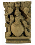 Brown sheesham wood carving of multi-armed deity with ornate headgear, close-up, in good condition.