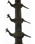 Close-up of a brass Indian oil burner, 13 inches tall, with three stylized animal figures extending from its side.