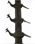Close-up of a brass Indian oil burner, 13 inches tall, with three stylized animal figures extending from its side.