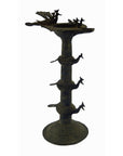 Brass oil burner with animal-shaped spouts and decorative base, 5 1/4 inch diameter, on plain background.