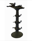 Brass oil burner with animal-shaped spouts and decorative base, 5 1/4 inch diameter, on plain background.