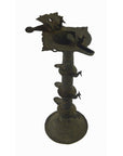 Brass Indian oil burner, tall and ornate with multiple tiers and animal designs, 5.25" diameter, close-up view.