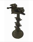 Brass Indian oil burner, tall and ornate with multiple tiers and animal designs, 5.25" diameter, close-up view.