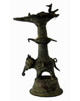 Brass animal-shaped oil burner with vase design and platform on back, close-up against plain background.