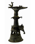 Brass Indian oil burner with intricate detailing, used as a collectible or decorative vase, close-up view.