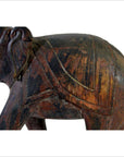 Close-up of a vintage carved wooden Indian elephant in good condition, showing head, ear, partial back and side.