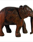 Close-up of brown wooden Indian elephant figurine with detailed carvings, all four legs visible, good condition.