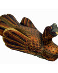 Close-up of brown hand carved wooden duck with detailed feathers, orange spots, and woodworm holes on curved neck.