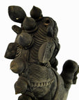 Close-up of brown wooden Indian Kerala hand carved horse, showing one ear and raised hand with detailed carved patterns.