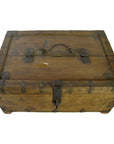 Brown metal-reinforced Indian Mughal storage box with top handle, closed, on white surface.