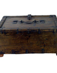 Brown metal-reinforced wooden Mughal storage box with top handle and central latch, close-up.