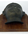 Brass bas-relief plaque with Indian temple design on wood, close-up, 8x4x1.5 inches, very good condition.