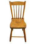 Brown wood Indonesian chair with curved backrest and vertical slats, front view on white background.