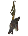 Brown wooden deer head wall trophy with painted details and large hand-carved antlers, close-up view.