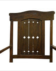 Dark wood Indonesian Java chair with carved arch and diamond cut-out backrest, front view on white background.