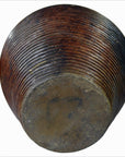 Close-up of a large brown ribbed ceramic vase with a flat base, bowl-shaped, from Lombka Island, Indonesia.