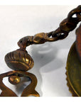 Close-up of vintage brass Japanese temple incense burner with ornate metalwork and decorative clasp, 19 inches long.