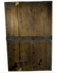 Close-up of back of black lacquered Japanese calligraphy wall panel, taped and repaired crack near reinforcement bar.