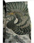 Green, gray, and gold embroidered bird pattern on Japanese silk sash, close-up of fabric detailing.