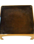 Glossy dark brown lacquered bamboo tea ceremony tray with lighter wood frame, close-up.