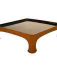 Glossy black lacquered bamboo tray with brown sides on white background.